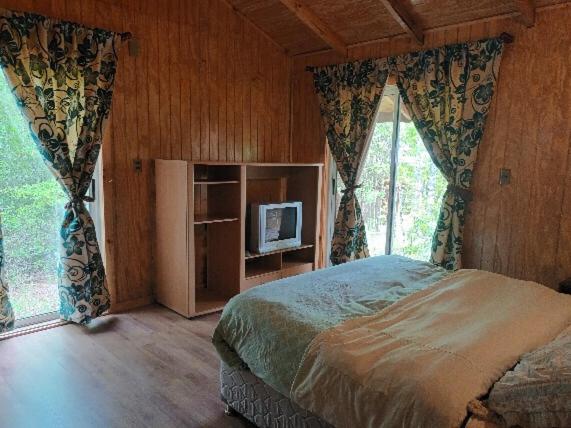 Ένα ή περισσότερα κρεβάτια σε δωμάτιο στο Cabaña entre Arboles