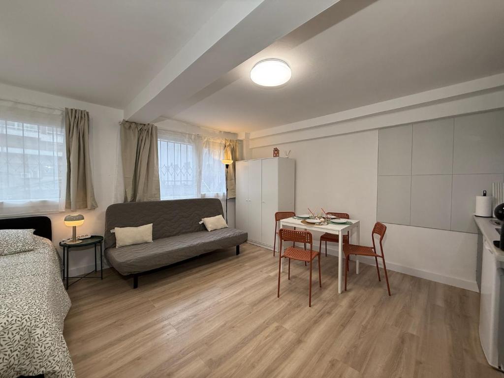 a living room with a couch and a table at Estudios Areal in Vigo