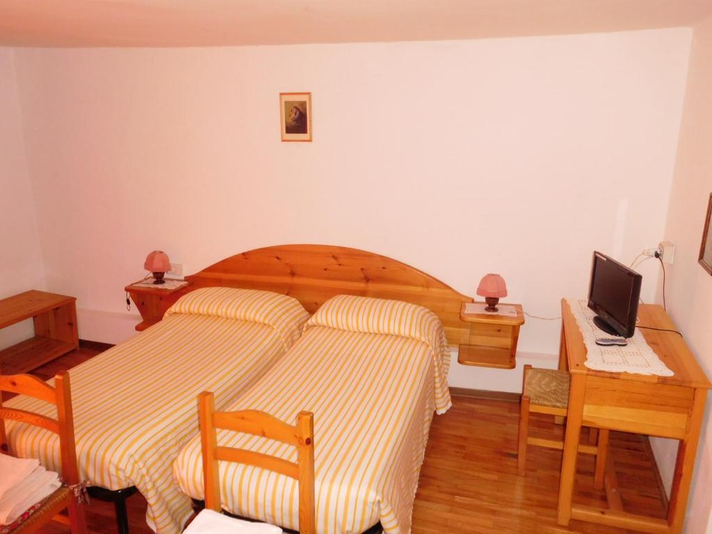 Postel nebo postele na pokoji v ubytování Antico Albergo Sant'Antonio