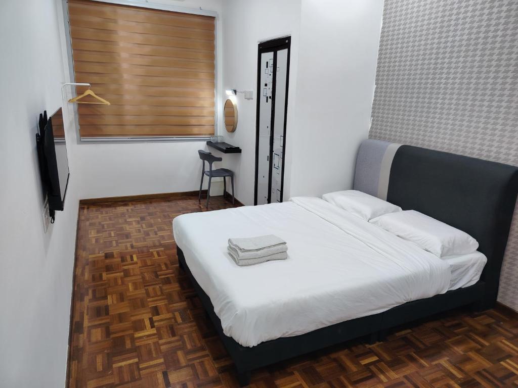 Ένα ή περισσότερα κρεβάτια σε δωμάτιο στο YNY Guest House