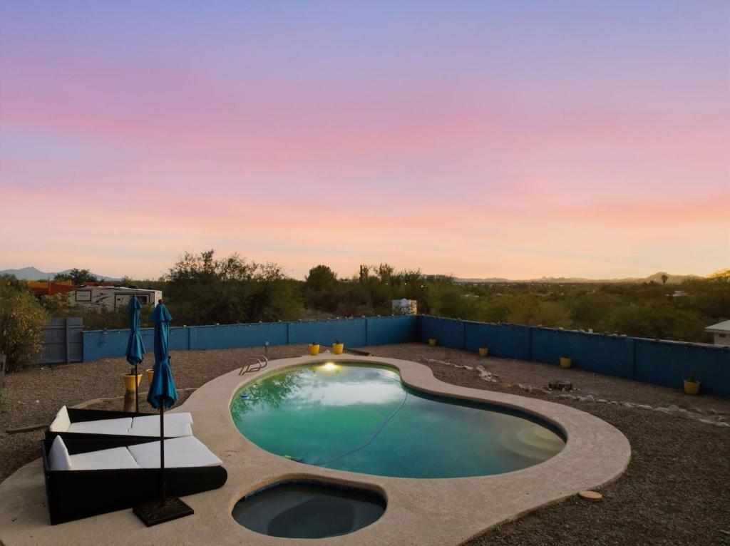 a swimming pool in the middle of a yard at New Sonoran Oasis pool hot Tub Sleeps 12 in Tucson