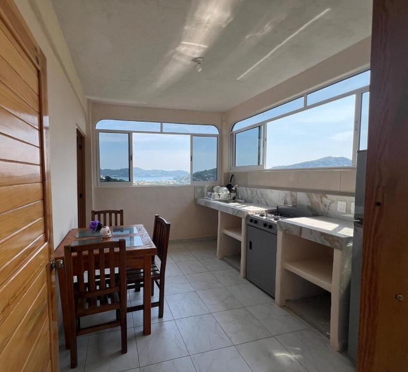 Kuchyň nebo kuchyňský kout v ubytování Acogedor departamento con vista al mar