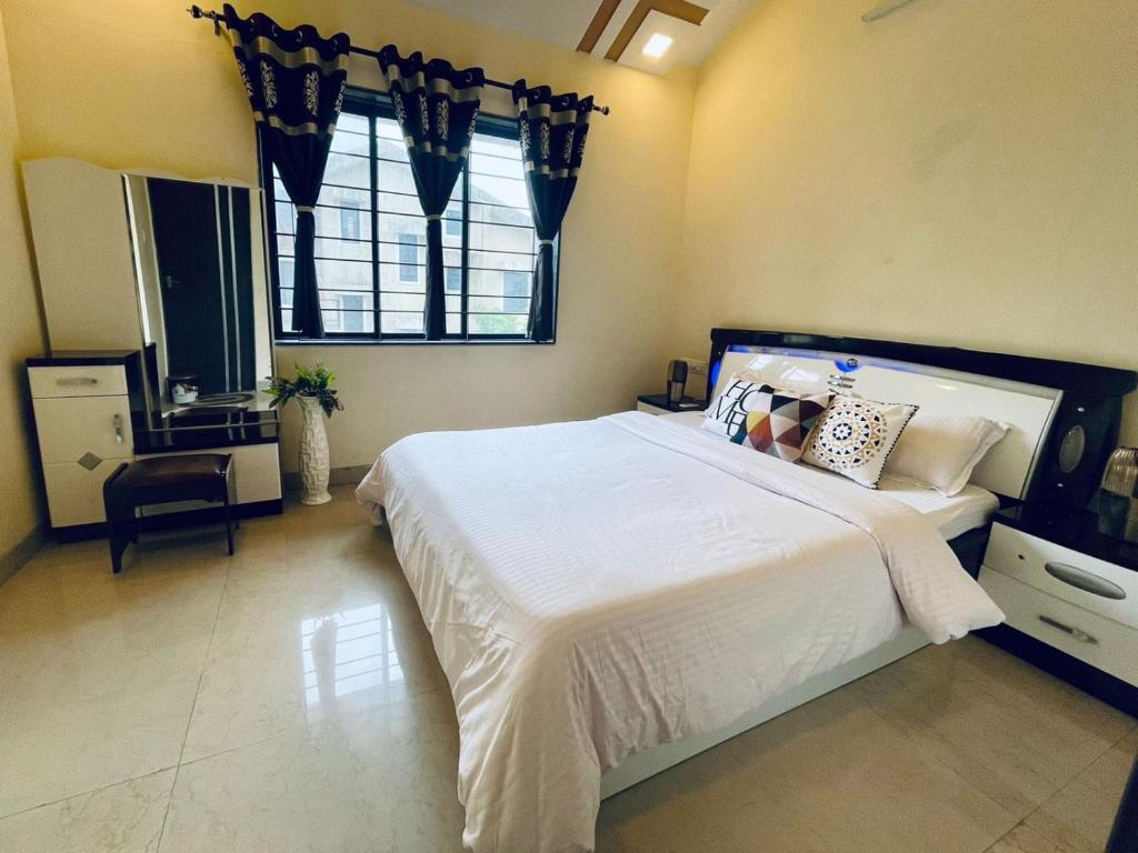 Ένα ή περισσότερα κρεβάτια σε δωμάτιο στο Choudhary villa 3bhk