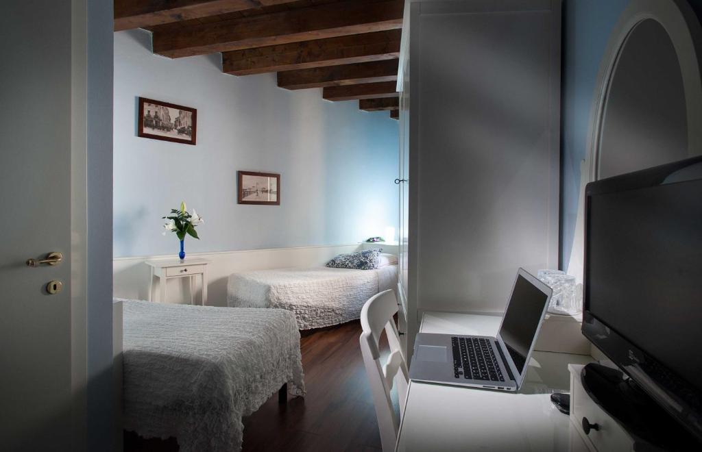 Postel nebo postele na pokoji v ubytování Hotel Al Castello
