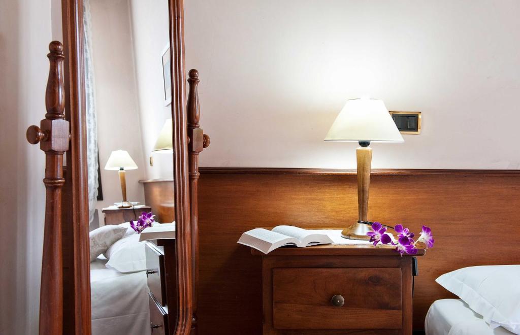 Postel nebo postele na pokoji v ubytování Hotel Al Castello