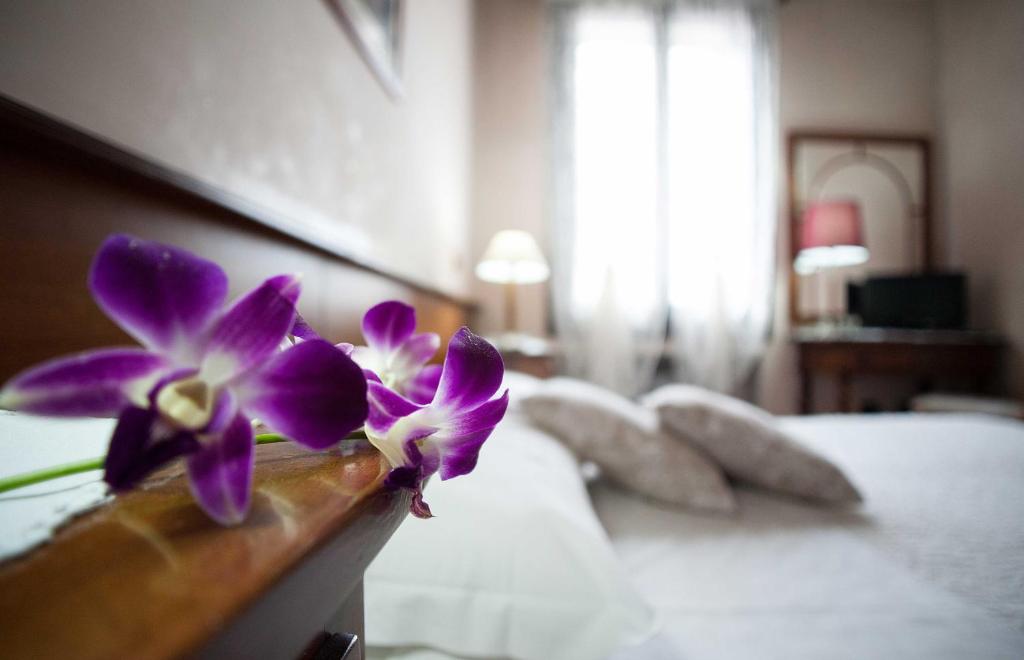 Postel nebo postele na pokoji v ubytování Hotel Al Castello