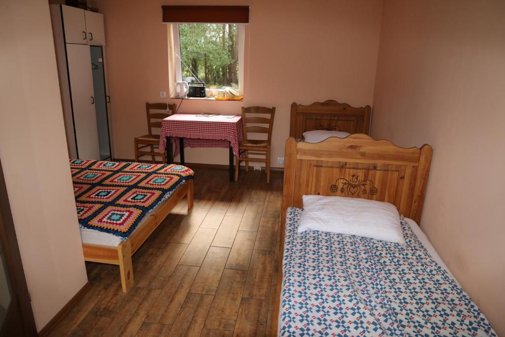Postel nebo postele na pokoji v ubytování Chata Kurpiowska