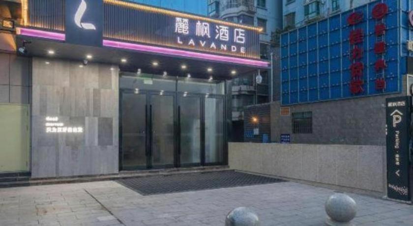 a building with a revolving door in a city at Lavande Hotels· Suizhou Wenfeng in Suizhou
