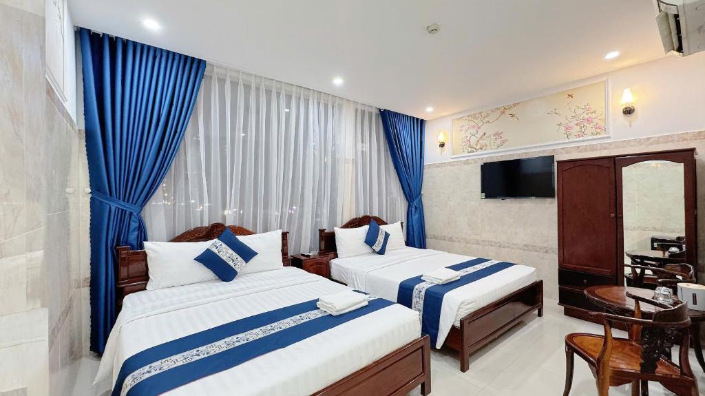 Ένα ή περισσότερα κρεβάτια σε δωμάτιο στο Victory Hotel 153-155