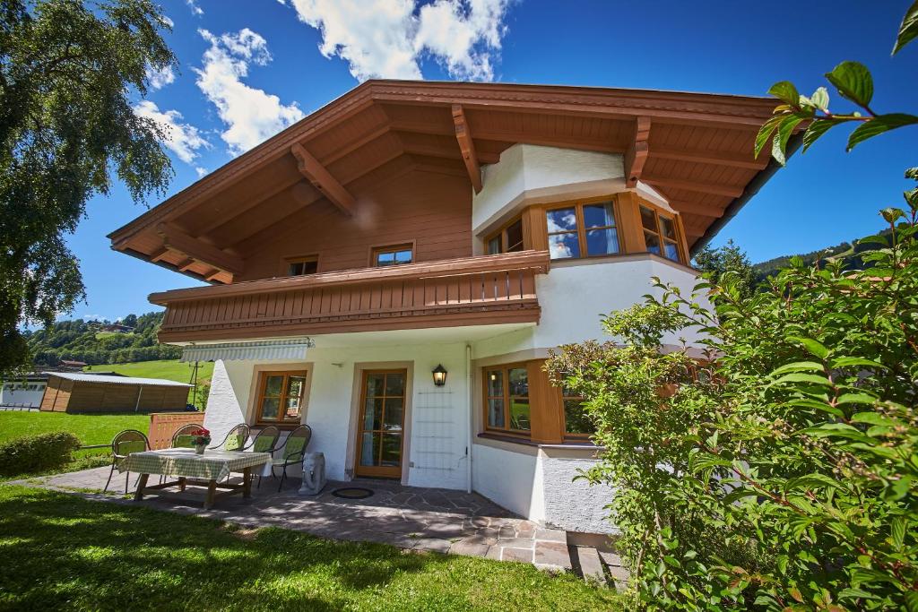 a small house with a wooden roof at Holiday Lodge Felix in Saalbach-Hinterglemm