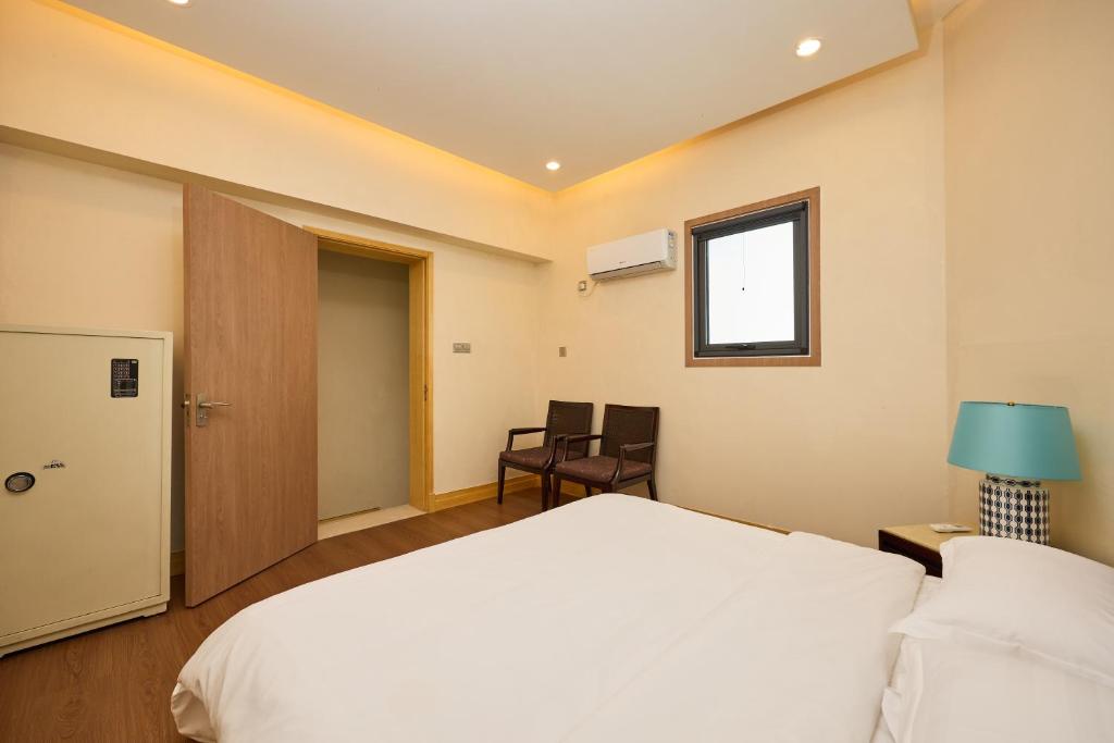 Giường trong phòng chung tại 北京和乔丽致酒店