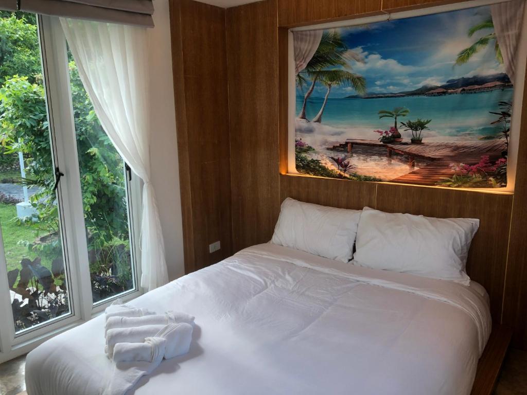 Ένα ή περισσότερα κρεβάτια σε δωμάτιο στο ปันดีเต็มวง Pandeethemwong