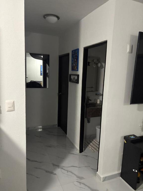 TV a/nebo společenská místnost v ubytování Tu mejor lugar de relajación en Acapulco diamante a unos pasos del centro comercial LA ISLA y del FORUM