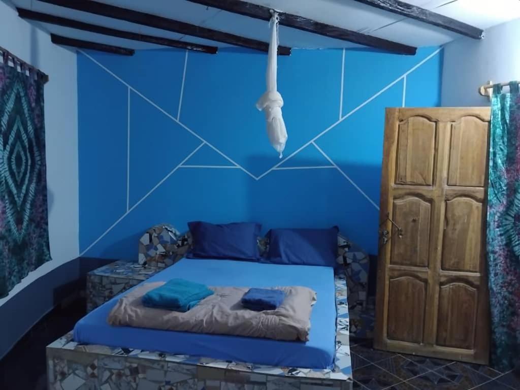 Postel nebo postele na pokoji v ubytování Campement les Antilles