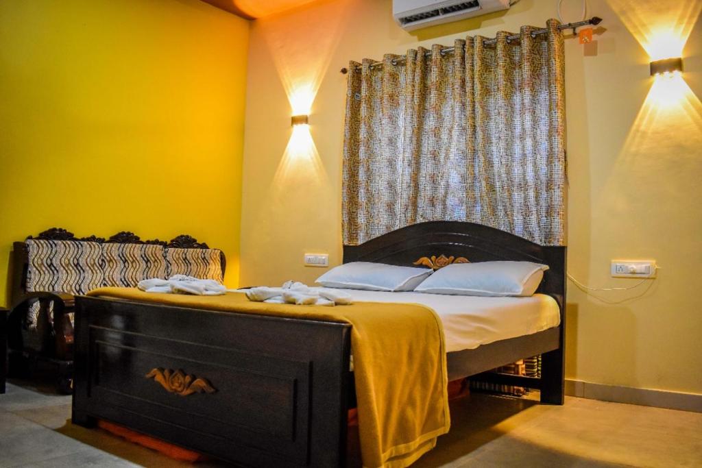 En eller flere senge i et værelse på Green View Resorts