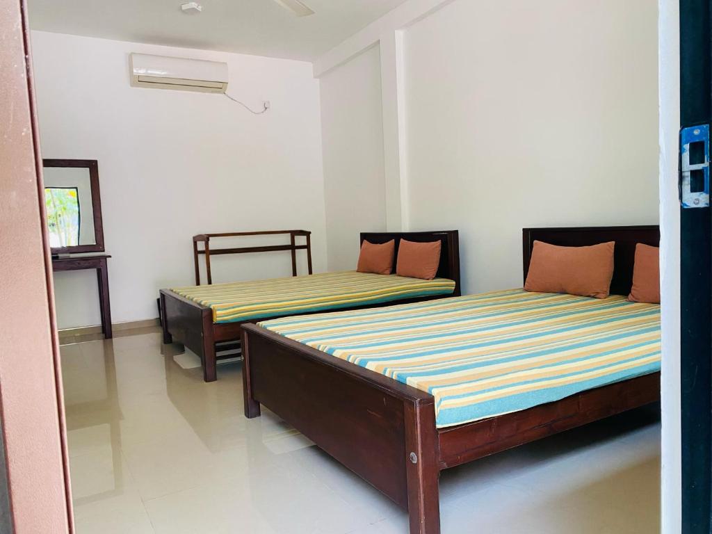 En eller flere senge i et værelse på The Paramount Lodge