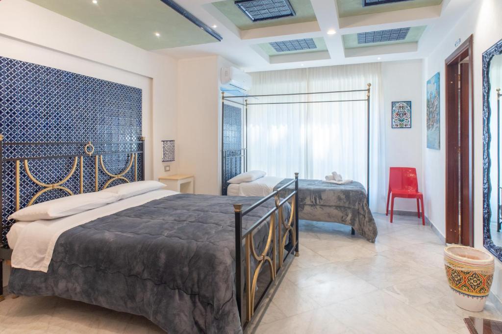 Postel nebo postele na pokoji v ubytování Federico 70 Arabic Style