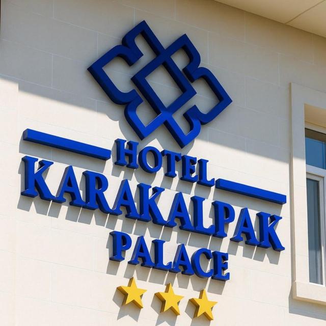a hotel karachi palace sign on the side of a building at Karakalpak Palace Hotel in Nukus