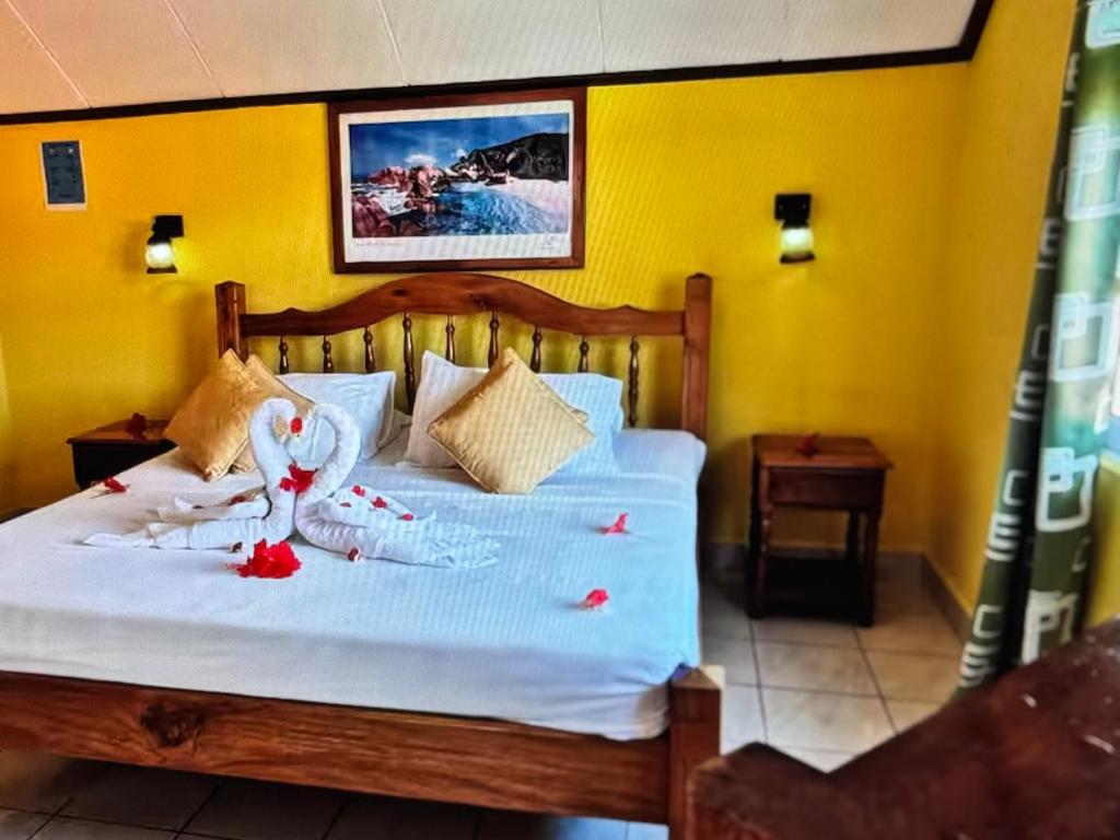 a bedroom with a bed with some decorations on it at Relax in Paradise in Victoria