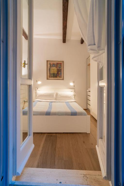 a bedroom with a bed and a window at The Luxury Roma Amor in Rome