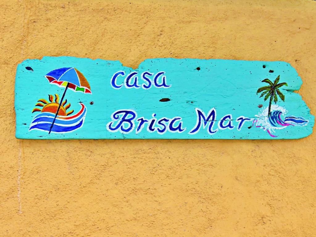 a sign that says casa brasiliama on a wall at Casa Brisamar , Studios in Puerto Morelos