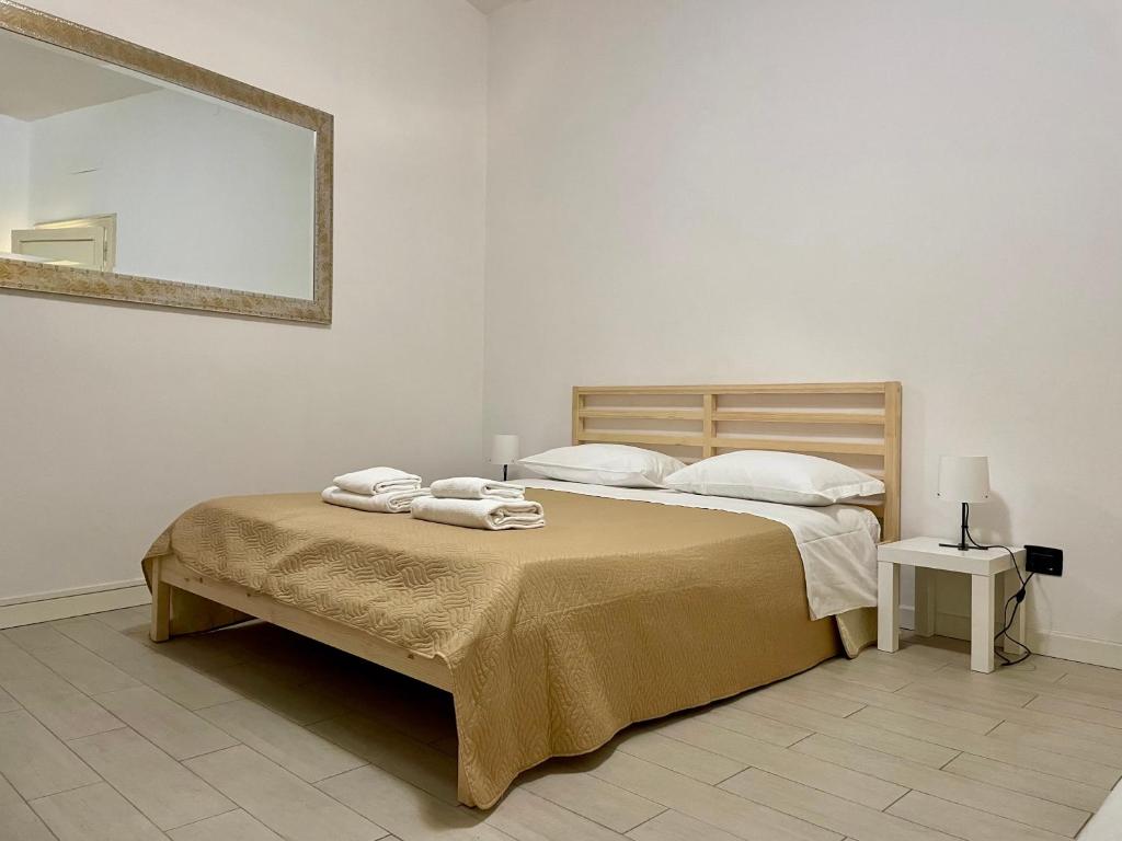 Ένα ή περισσότερα κρεβάτια σε δωμάτιο στο Domus Pellicciai