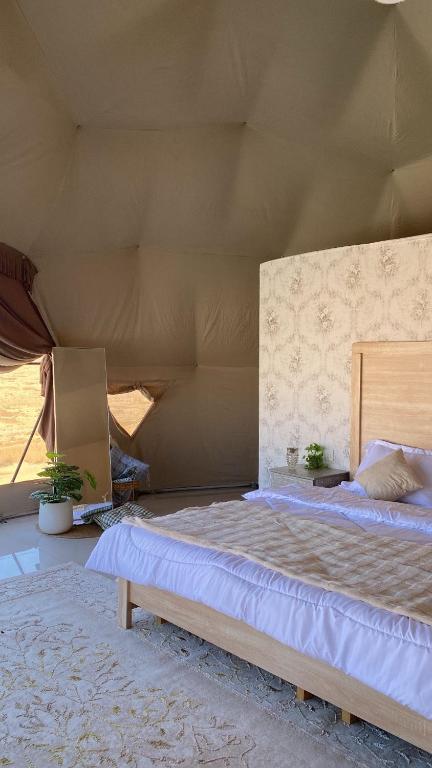 Postel nebo postele na pokoji v ubytování Wahiba Sand private dome