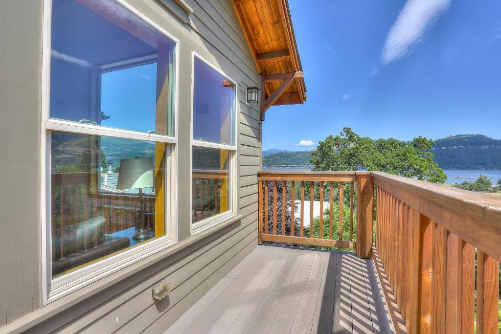 a balcony with a view of the water at Hutson's Bridgeview 30 Day in Hood River