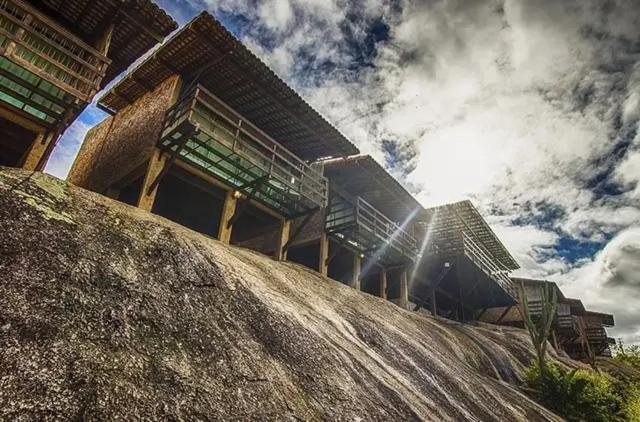 a building with stairs on top of a hill at Pousada Villas da Serra in Serra de São Bento