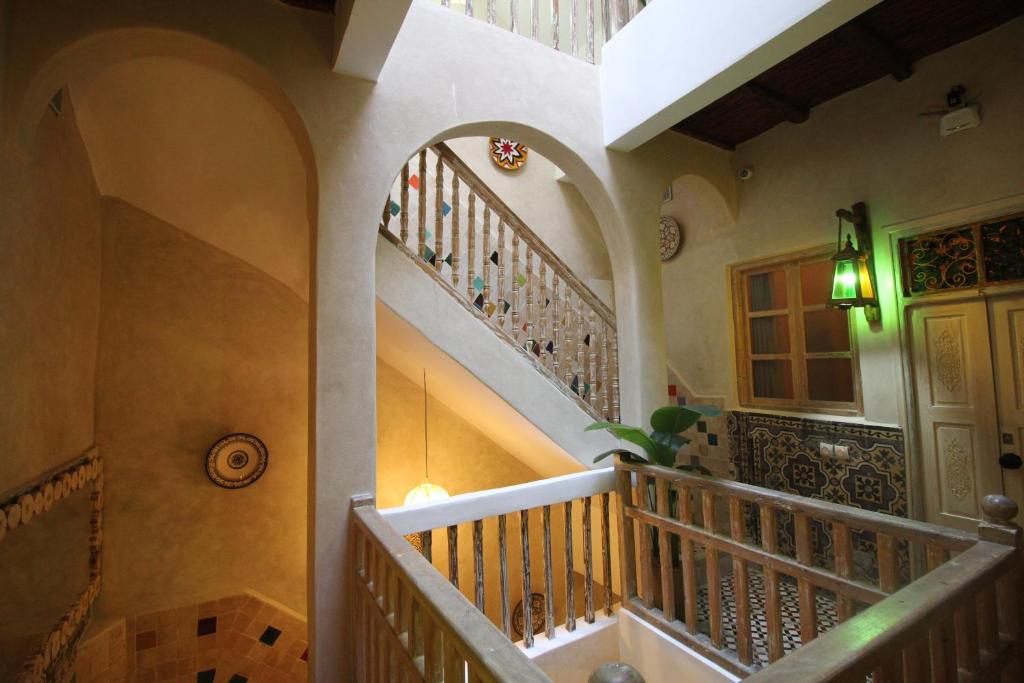 a staircase in a home with a stair case at Dar Aicha in Essaouira
