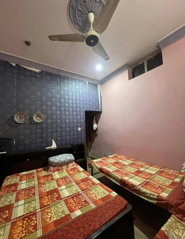 Postel nebo postele na pokoji v ubytování Choudhary House