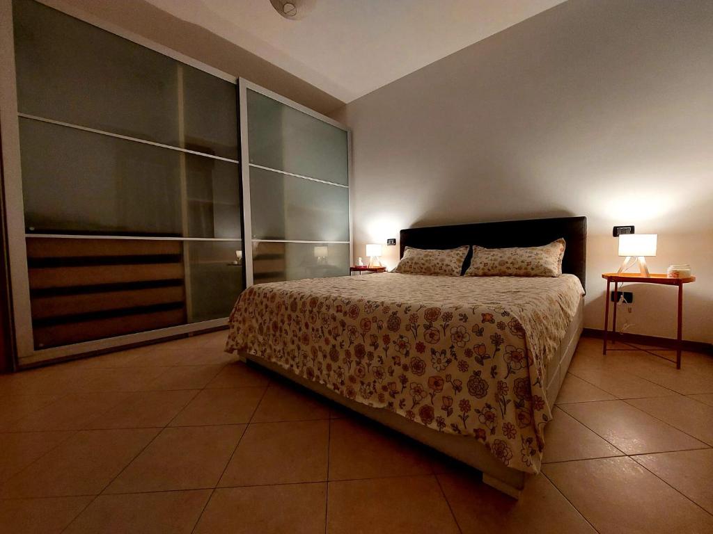 Ένα ή περισσότερα κρεβάτια σε δωμάτιο στο Casetta Lisa