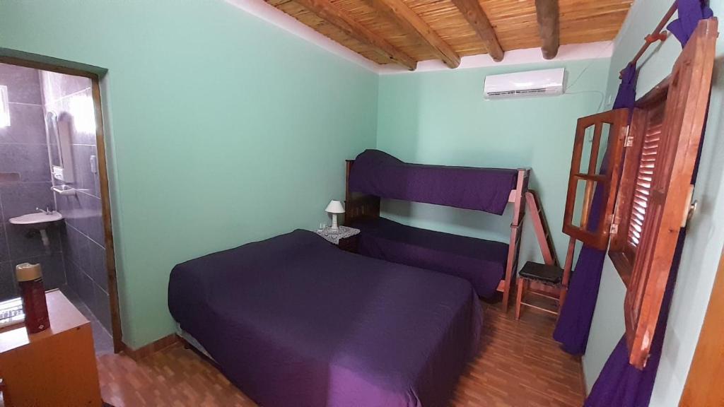 En eller flere senge i et værelse på Cabaña DOÑA LILIA