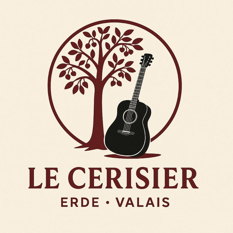a tree with a guitar and the words le centier eagle valleys at Le Cerisier in Erde