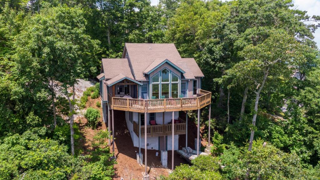 an aerial view of a house in the woods at Echota Ridge Boulders in Banner Elk
