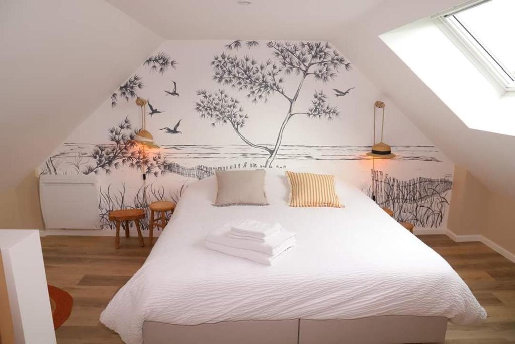 Postel nebo postele na pokoji v ubytování Le Bon Temps, pour une douce parenthèse