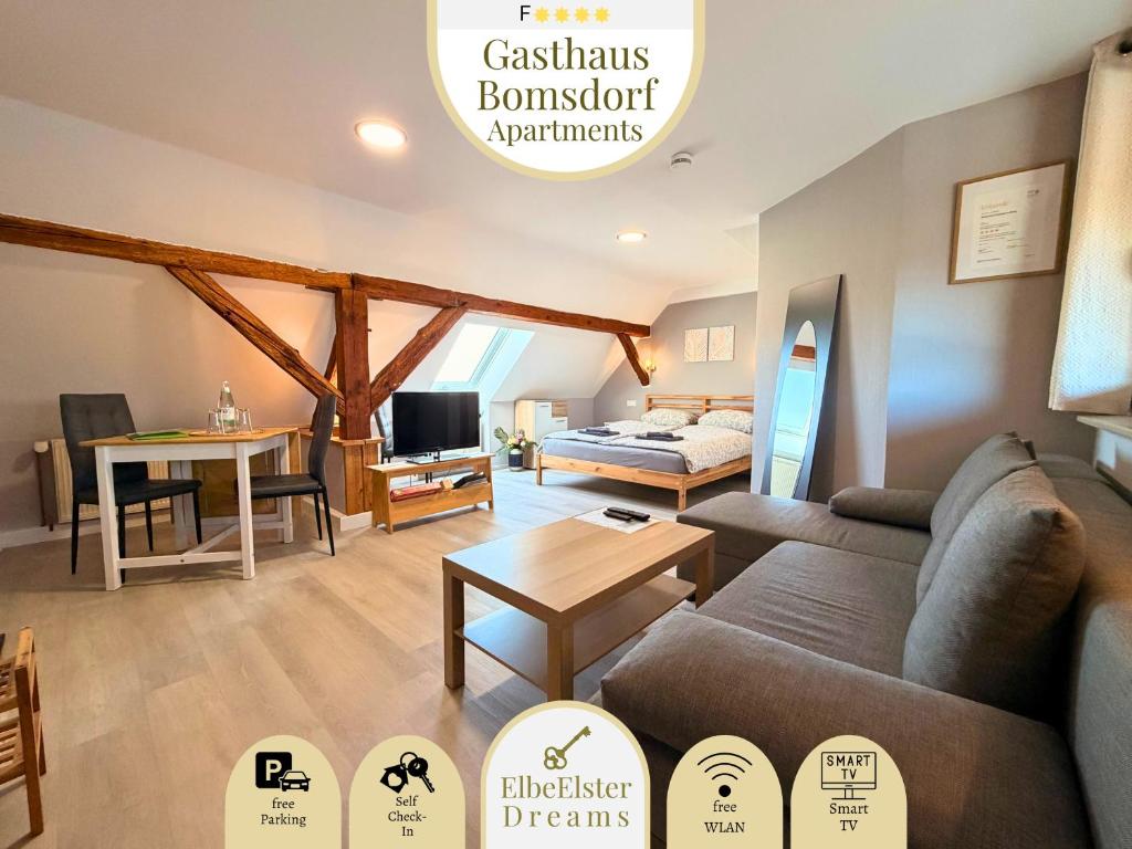 a living room with a couch and a bed at Gasthaus Bomsdorf - ruhige Lage, free WLAN & Parken, Self Check-In, Smart-TV in Bomsdorf