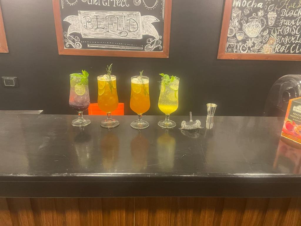 a group of glasses sitting on top of a bar at vision suites Arbia Hurghada in Hurghada