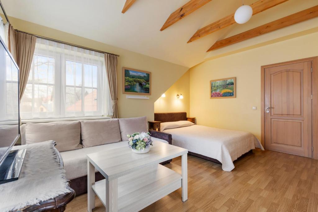 Postel nebo postele na pokoji v ubytování Vila Liepa