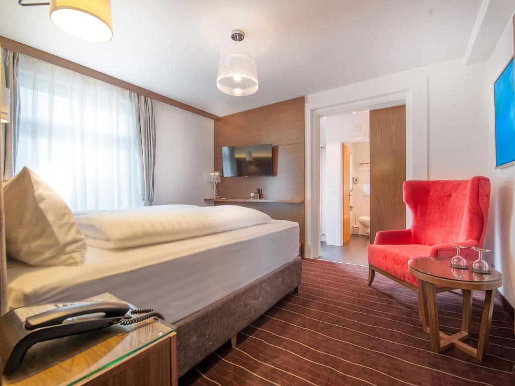 Postel nebo postele na pokoji v ubytování arthausHOTEL