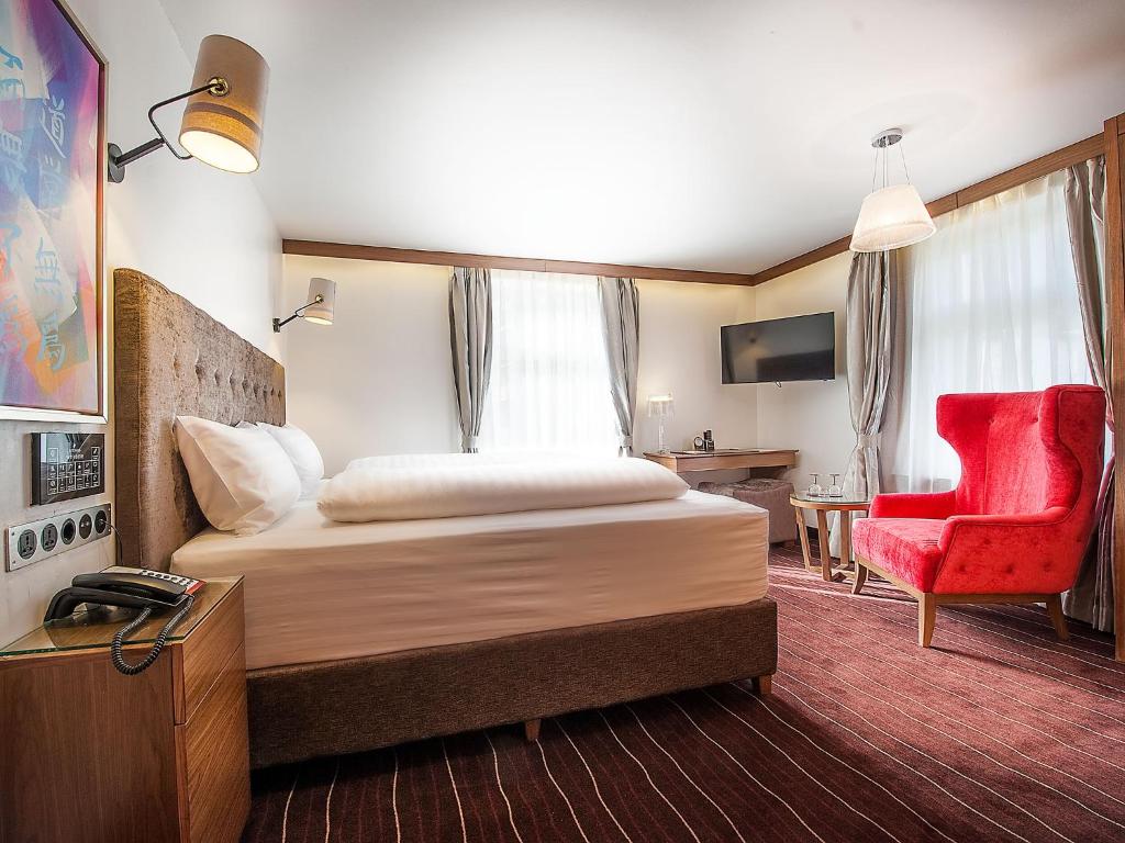Postel nebo postele na pokoji v ubytování arthausHOTEL