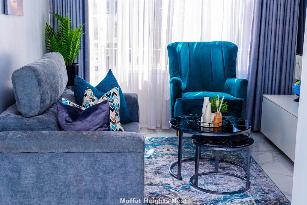 a living room with a couch and two chairs at MoffatHeights Nest in Harare