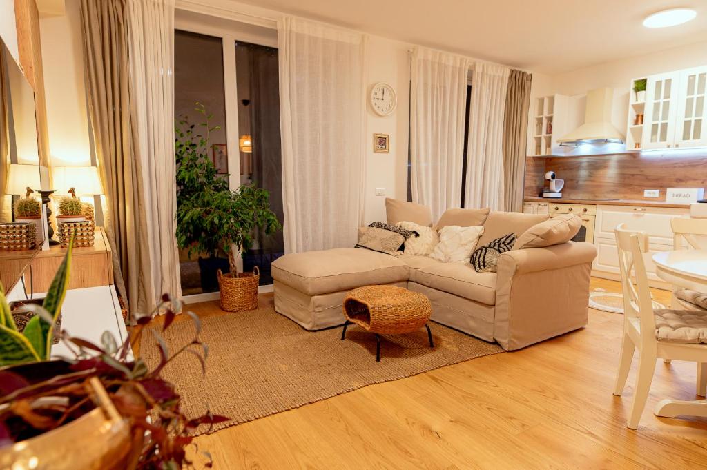 a living room with a couch and a table at Anur Apartment II in Ptuj