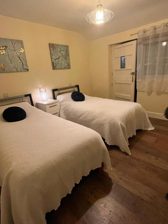 Postel nebo postele na pokoji v ubytování Queens Head