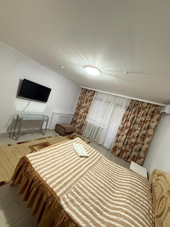 Giường trong phòng chung tại гостиница Азия