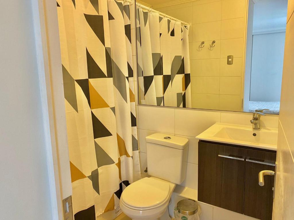 Et badeværelse på Depto Parque Parinacota a pasos de la playa