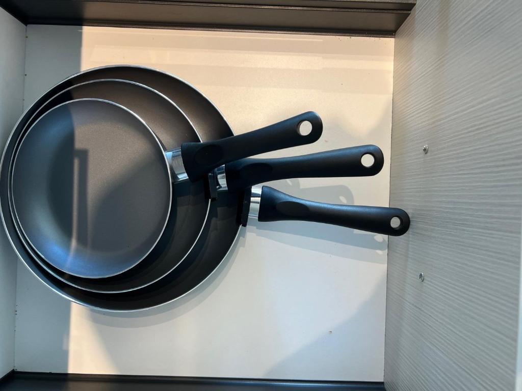 a frying pan hanging on a wall in a room at Vibrant 1 Bedroom Condo Apt in Toronto