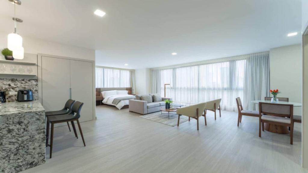 a living room with a couch and a table at Deluxe Loft with Urban Views in Costa del Este in Panama City