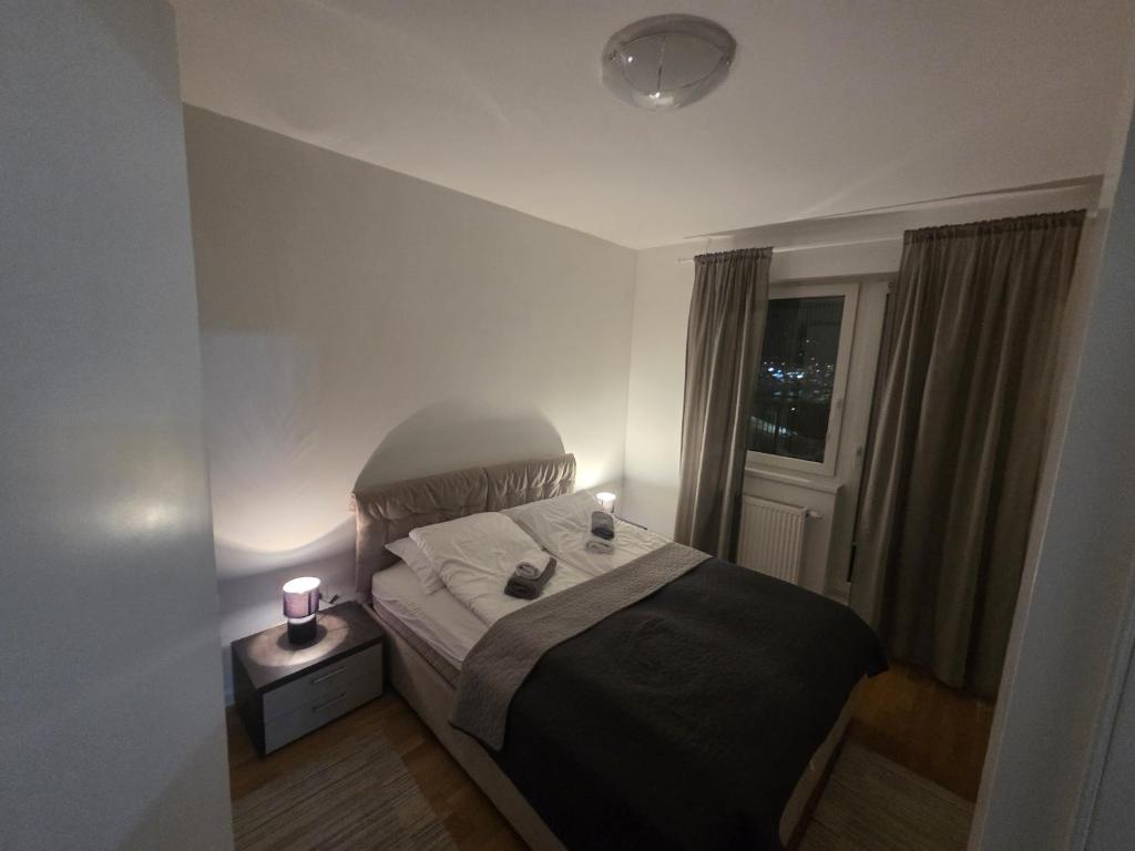 Postel nebo postele na pokoji v ubytování Apartman IsTar View