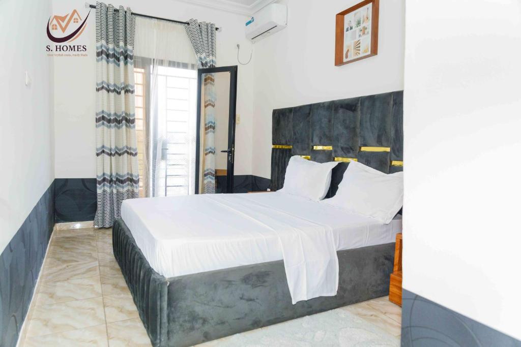 Ένα ή περισσότερα κρεβάτια σε δωμάτιο στο Siri's Home